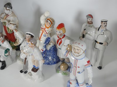Lot 143 - A collection of eight Kiev porcelain figures,...
