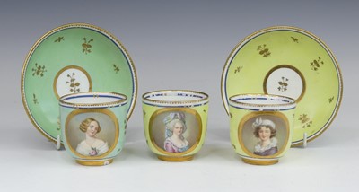 Lot 2098 - A set of three Vienna porcelain tea cups and...