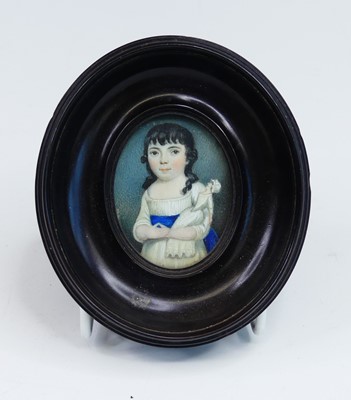 Lot 2428 - A half-length portrait miniature of a young...