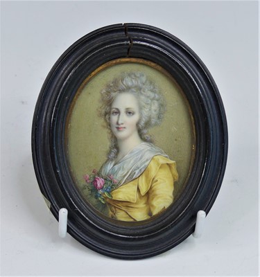 Lot 2429 - A half-length portrait miniature of a lady,...