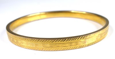 Lot 2701 - A George V 9ct gold hollow bangle, of...