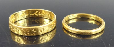 Lot 2528 - A 22ct gold narrow court shaped wedding band,...