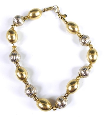 Lot 2542 - An Italian 18ct yellow and white gold necklace,...