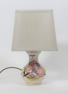 Lot 5 - A Moorcroft Hibiscus pattern table lamp with...