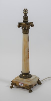 Lot 19 - A brass and polished hardstone table lamp, in...