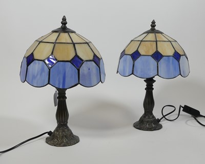 Lot 25 - A pair of Tiffany style table lamps, each...