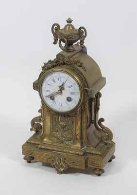 Lot 44 - A 20th century brass mantel clock, the...