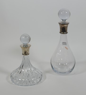 Lot 54 - Two silver collared glass decanters, one of...