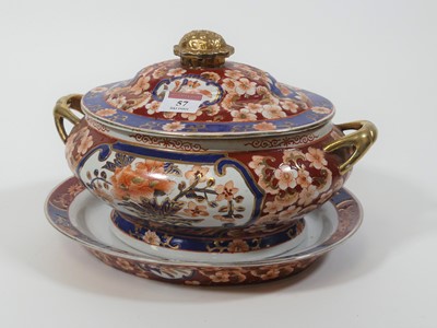 Lot 57 - A porcelain tureen and stand, heavily enamel...