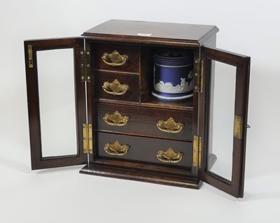 Lot 106 - An early 20th century oak smoker's cabinet,...