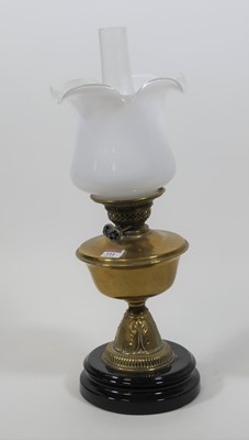 Lot 111 - A 19th century brass oil lamp, having a milk...