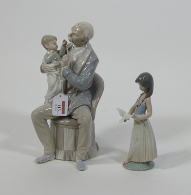 Lot 113 - A Lladro porcelain figure of a father and son,...