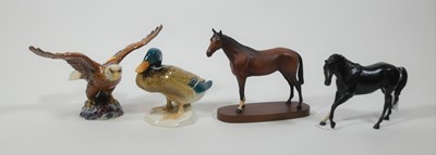 Lot 186 - A collection of four Beswick models of animals,...