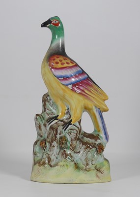 Lot 204 - A 19th century Staffordshire figure of an...