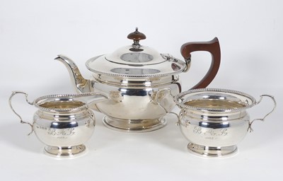 Lot 268 - A George V silver three-piece tea service,...