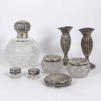 Lot 282 - A collection of silver lidded dressing table...