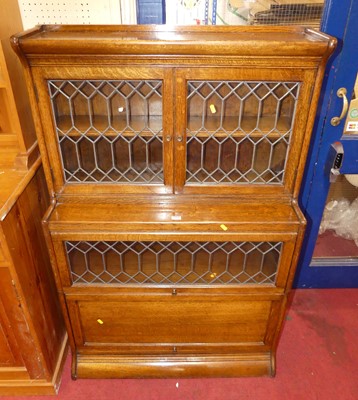 Lot 1114 - A 1930s oak and lead glazed stacking bookcase,...