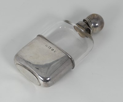 Lot 305 - A George V silver and glass hip flask,...