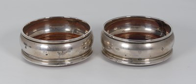 Lot 306 - A pair of modern silver wine coasters, each...