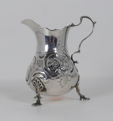 Lot 315 - A Victorian silver milk jug, repoussee...