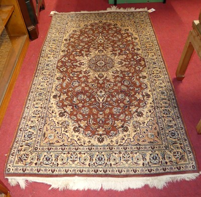 Lot 1147 - A Persian woollen brown ground Kashmir rug,...