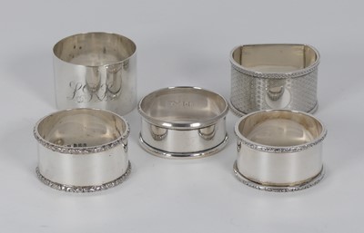 Lot 323 - A collection of five various silver napkin...