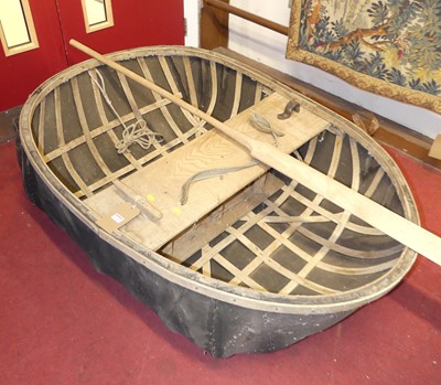 Lot 1156 - A vintage hand-built coracle with paddle,...