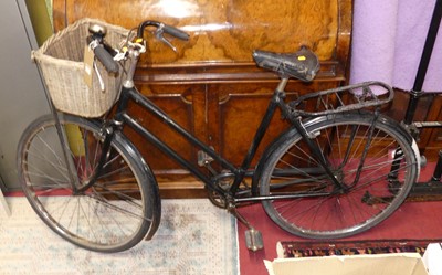 Lot 1164 - A vintage black painted metal lady's bicycle,...