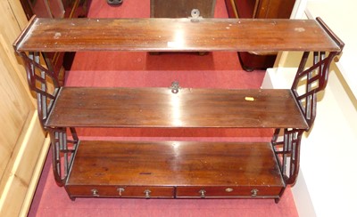 Lot 1216 - A circa 1900 mahogany three-tier wall shelf,...