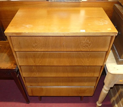 Lot 1223 - A 1960s teak chest of five long angled drawers,...