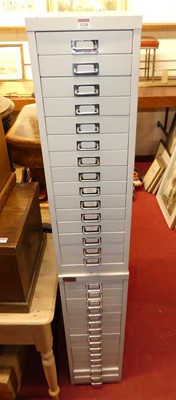 Lot 1228 - A pair of grey painted steel 15-drawer narrow...