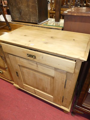 Lot 1248 - A rustic pine single door low side cupboard,...