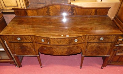 Lot 1255 - An Edwardian mahogany ledgeback part bowfront...