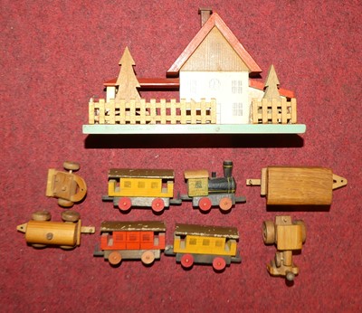 Lot 1632 - A wooden children's train station & loco set