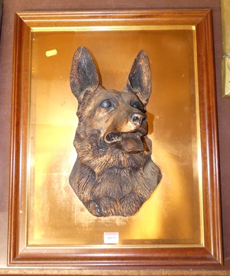 Lot 1059 - A bronzed composition of a wolf's head on...