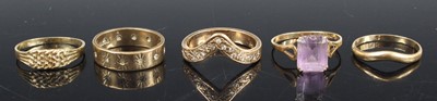 Lot 385 - A 9ct gold diamond point set wishbone ring,...