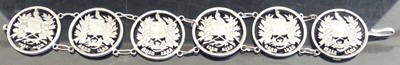 Lot 386 - A continental white metal coin bracelet, as...