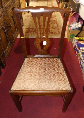 Lot 1321 - A George III provincial oak Chippendale style...