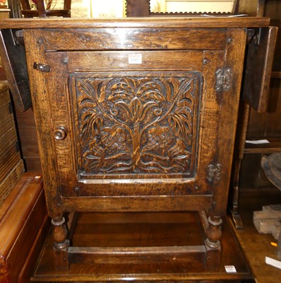 Lot 1285 - An 'Ipswich' joined oak drop flap single door...