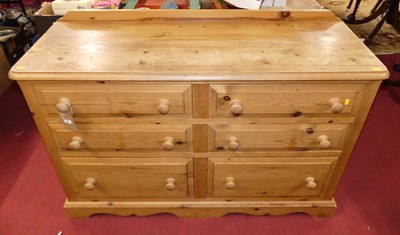 Lot 1319 - A modern pine round cornered side chest,...