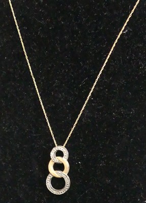 Lot 449 - A modern 9ct two-colour gold pendant on...