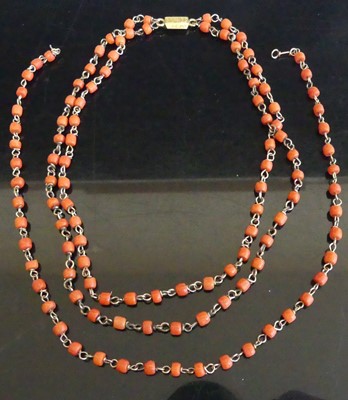 Lot 465 - A white metal and beaded coral choker, with...