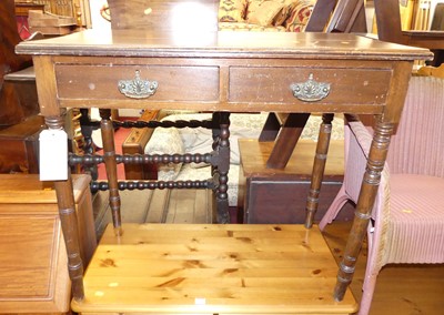 Lot 1369 - An Edwardian walnut two-drawer side table...