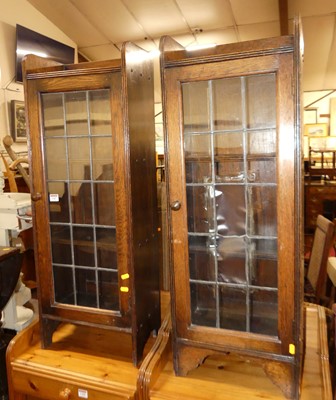 Lot 1387 - A pair of 1920s narrow oak single door lead...