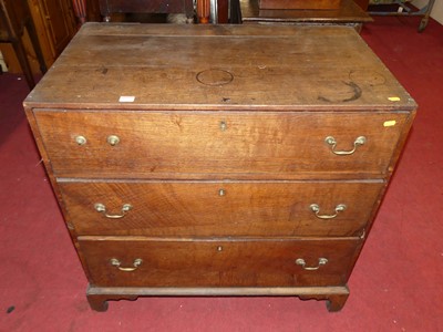 Lot 1393 - A circa 1800 provincial oak chest of three...