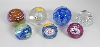 Lot 552 - A collection of glass paperweights