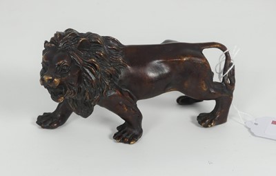 Lot 218 - A bronze model of a lion, shown standing, l.13....