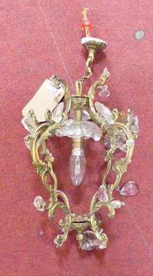 Lot 590 - A brass and cut glass ceiling light