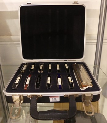 Lot 596 - A cased set of Hohner and other harmonicas