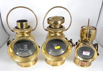 Lot 604 - Three various vintage brass carriage lamps,...